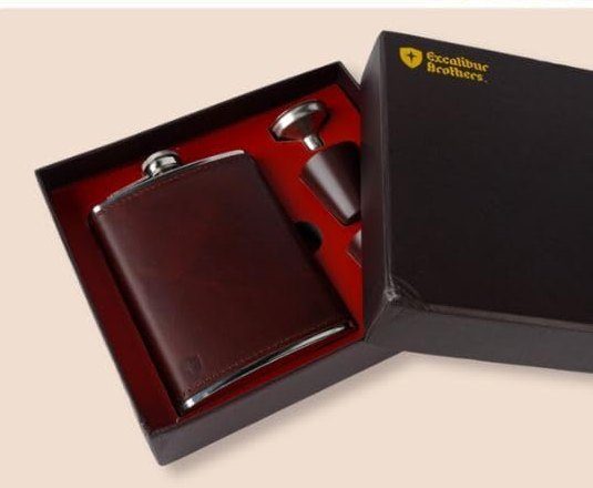 The open black box with the flask, funnel and cups seated in red lining