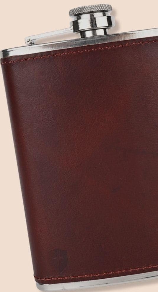 Close-up of the stitched brown leather wrap and steel cap