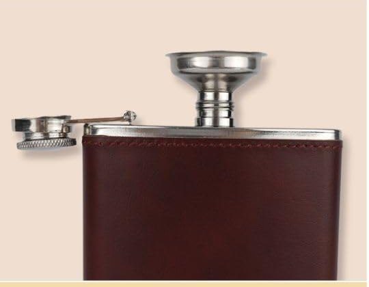The steel funnel seated in the flask's opening