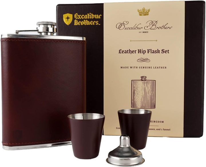 Leather hip flask, two dark shot cups and steel funnel in front of the black Excalibur Brothers presentation box