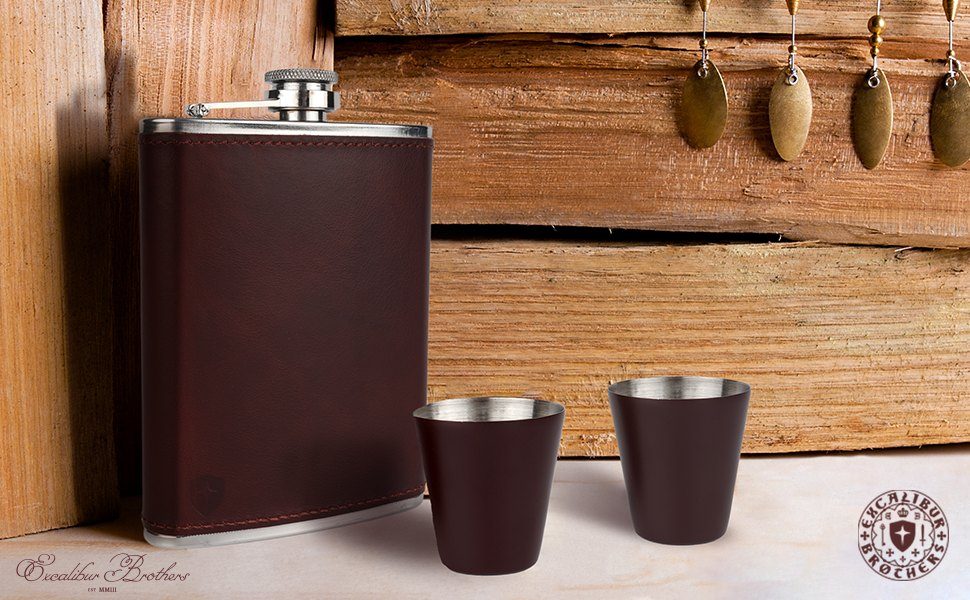 The flask and two cups on a wooden shelf